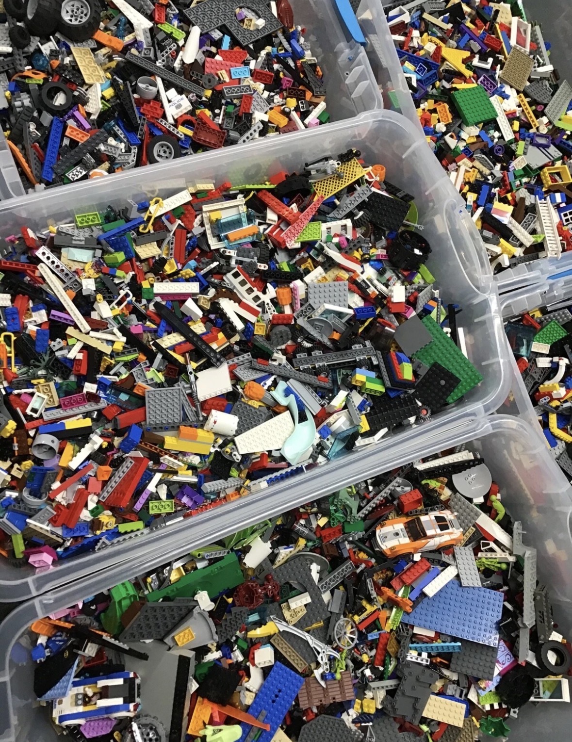 SML Bricks inventory: clear bins filled with colorful LEGO parts and builds